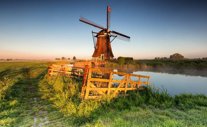 4K Morning Fog Over Dutch Windmill and Fields
