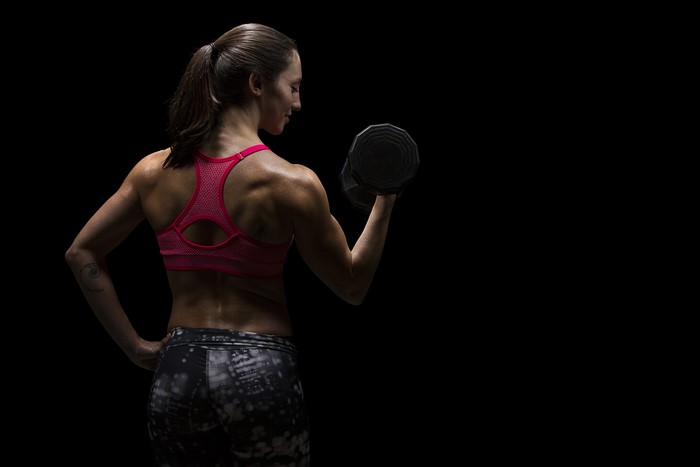 4K Fitness Woman Lifting Dumbbell