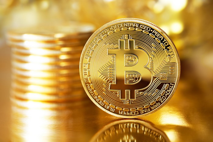 Gold Bitcoin Coin and Stack