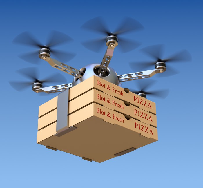 Drone delivering pizza boxes