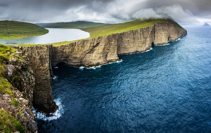 Dramatic cliffs overlooking the ocean and a lake in Denmark