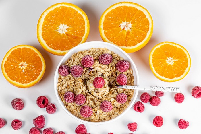 Muesli with raspberries and oranges