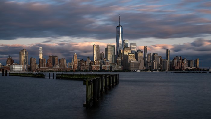 New York City skyline with One World Trade Center at sunset