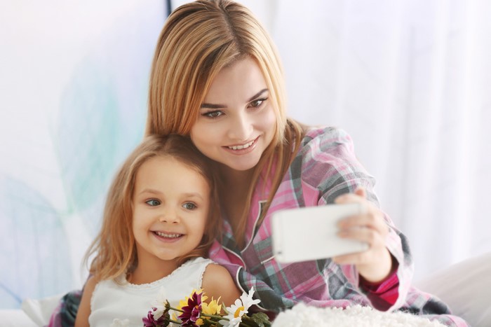Mother and daughter taking a selfie
