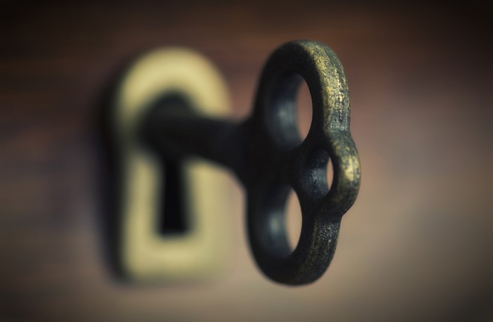 Close-up of an antique key in a keyhole