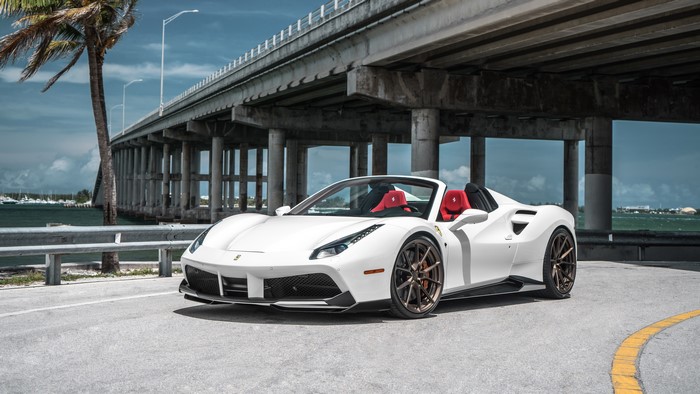 White Ferrari 488 Spider under a bridge
