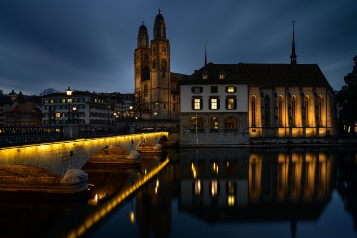 Zurich Grossmünster church and bridge at night