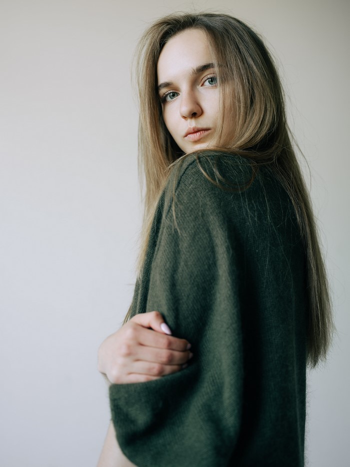 Yana in a green sweater