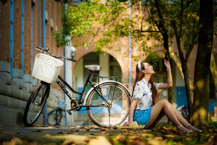 4K Asian Woman Sitting by Bicycle in Autumn