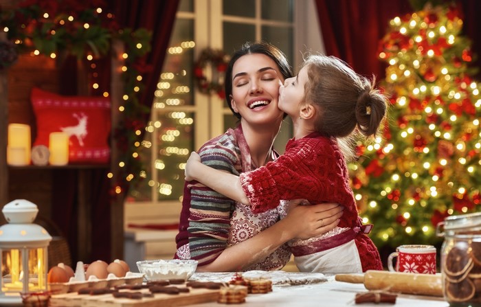 Mother and daughter baking cookies for Christmas
