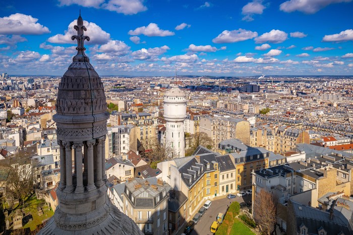 Paris cityscape with Sacre-Cœur dome and water tower