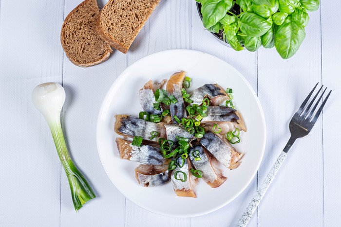 Sliced Herring with Scallions, Bread, and Basil
