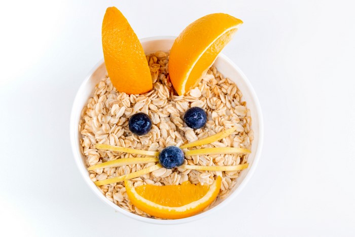 Creative Cat Face Oatmeal with Orange and Blueberries