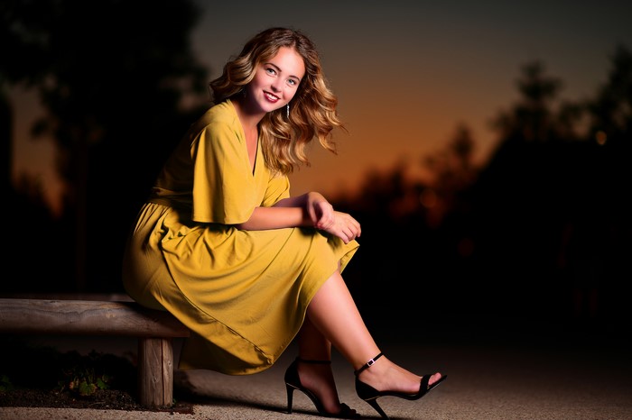 Selina in a yellow dress at evening