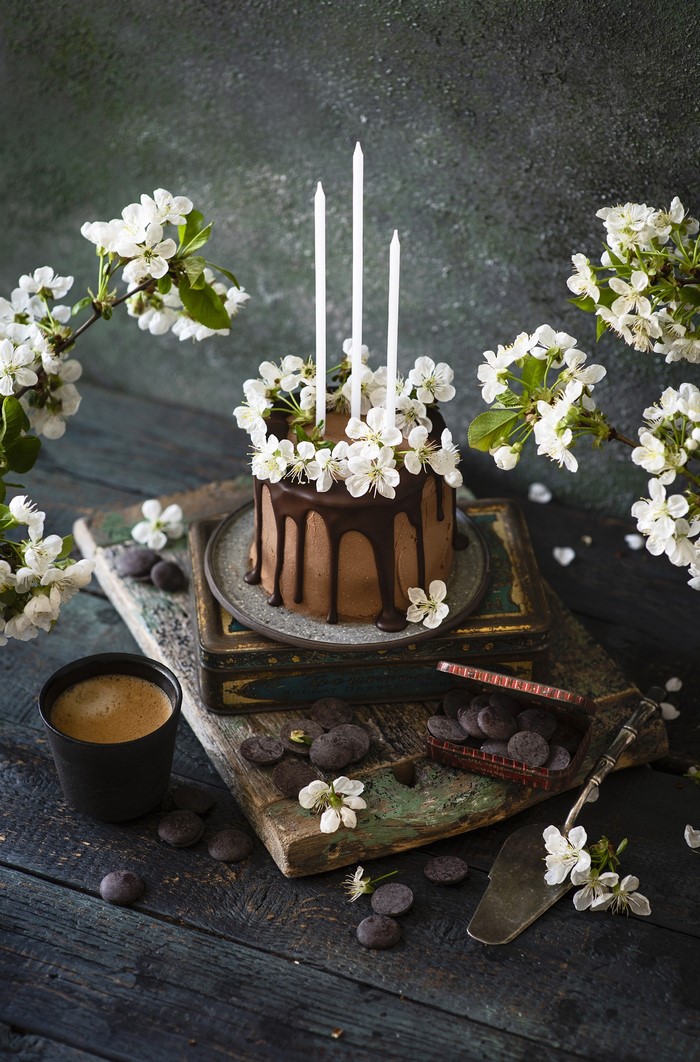 Chocolate cake with candles and coffee