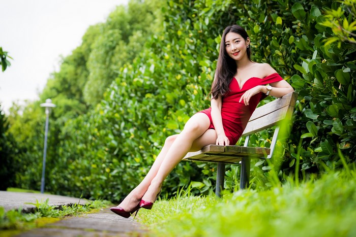 4K Asian Woman Sitting on Bench in Red Dress