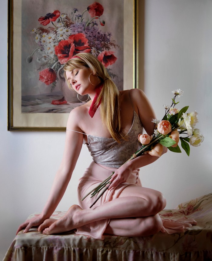 Carla Monaco Sitting with Flower Bouquet