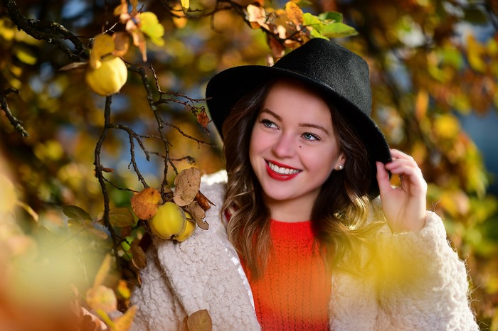 Selina wearing a hat in autumn foliage