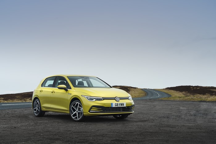 Yellow Volkswagen Golf Style on a Road