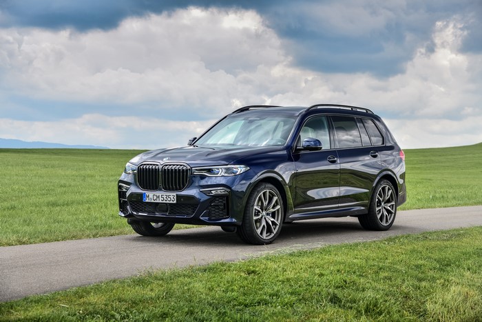 Blue BMW X7 M50i on a road