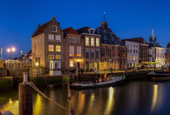 Houses and boats in Maassluis, Netherlands at night
