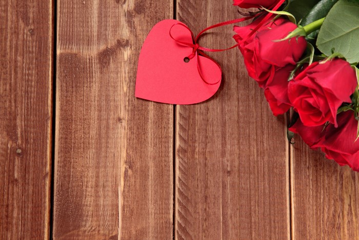 Red Roses and Heart Tag on Wood Planks