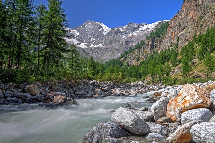 River flowing through a valley in Gran Paradiso National Park, Italy