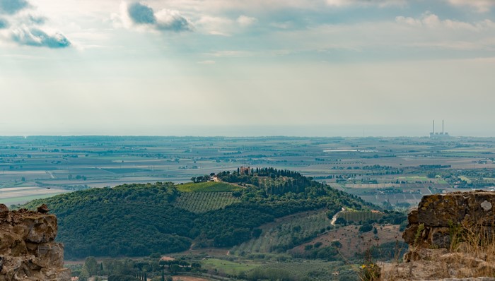 Tuscany landscape with power plant in the distance