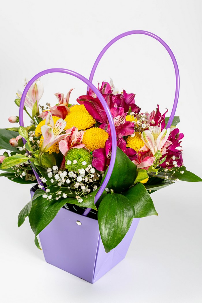 Purple heart-shaped basket with colorful flowers