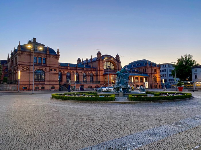 Town square with fountain and historic building in Schwerin, Germany