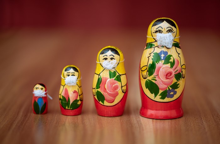 Matryoshka dolls wearing face masks