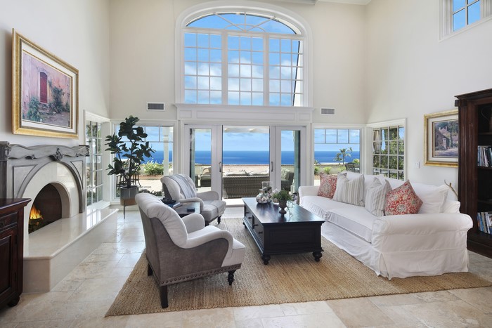 Living room with fireplace and ocean view