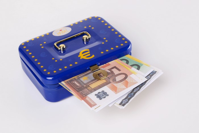 Blue money box with Euro banknotes