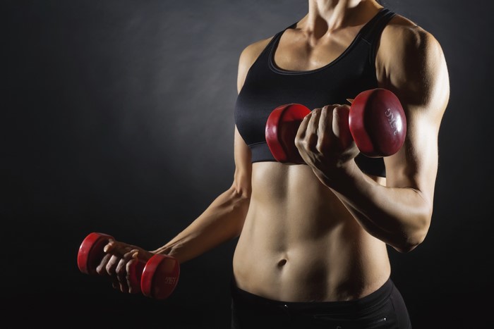 Woman exercising with dumbbells
