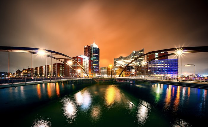 Hamburg skyline at night with bridge and river