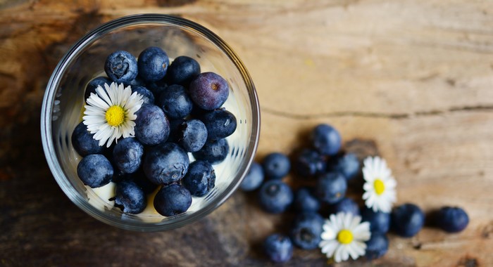 Blueberries and Camomiles in a Bowl