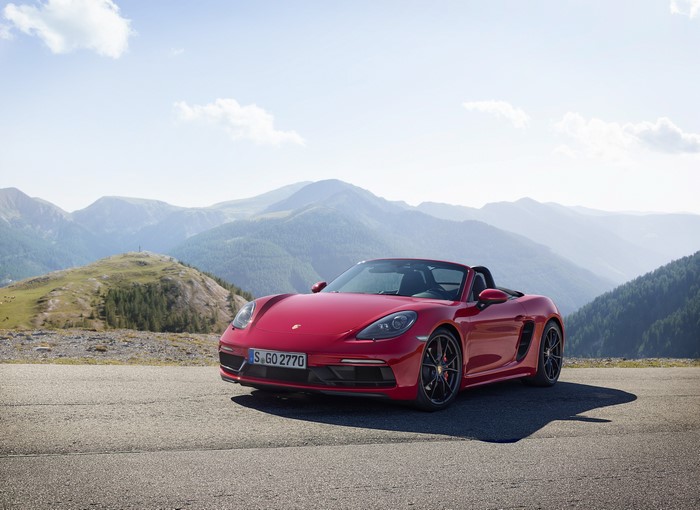 Red Porsche Boxster Roadster in Mountains