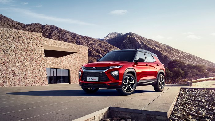 Red Chevrolet Trailblazer RS in front of stone building
