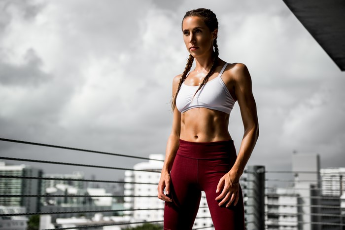 Woman in fitness pose with braided hair