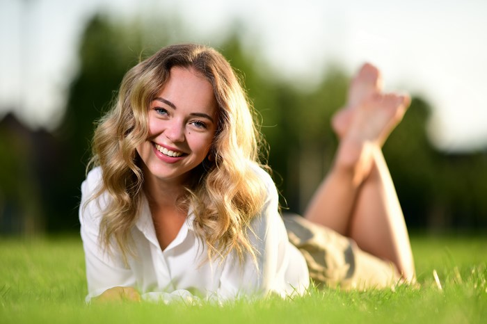 Selina Smiling on Grass with 4K Clarity