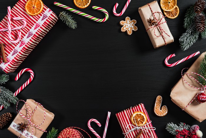 Christmas Gifts, Candy Canes, and Oranges Flat Lay