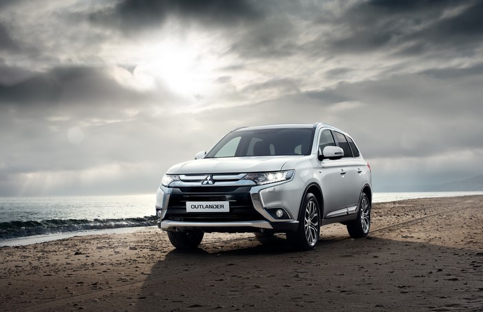 White Mitsubishi Outlander on a Beach