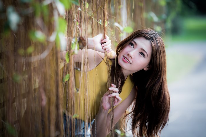 4K Asian Woman with Brown Hair in Nature