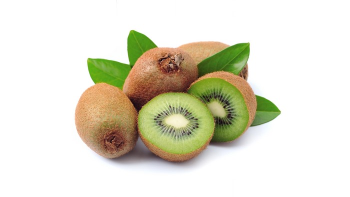 Kiwi fruits with leaves on white background