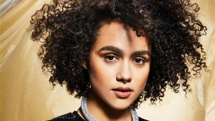 Nathalie Emmanuel with curly hair and nose ring