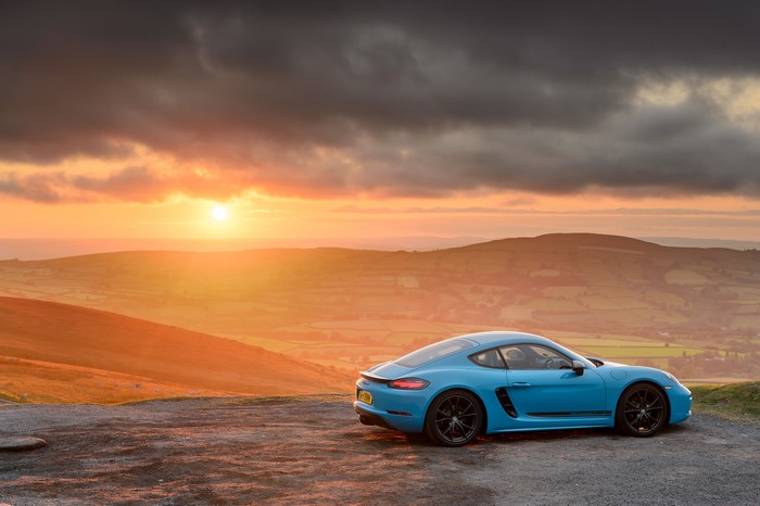 Blue Porsche 718 Cayman at Sunset
