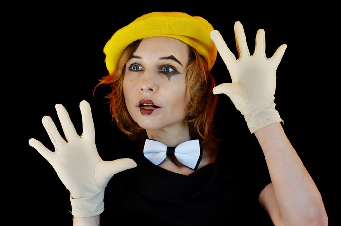 Mime artist with yellow beret and white bow tie