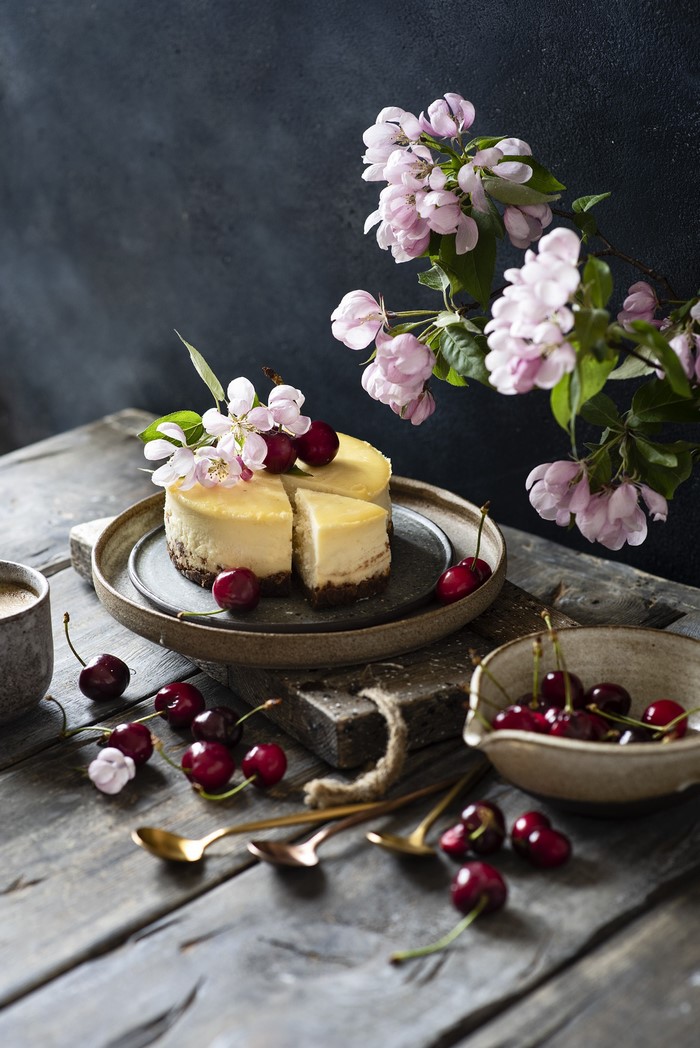 Cheesecake with cherries and apple blossoms
