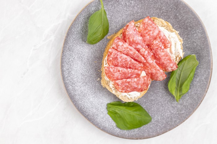 Sausage and cream cheese sandwich on a plate