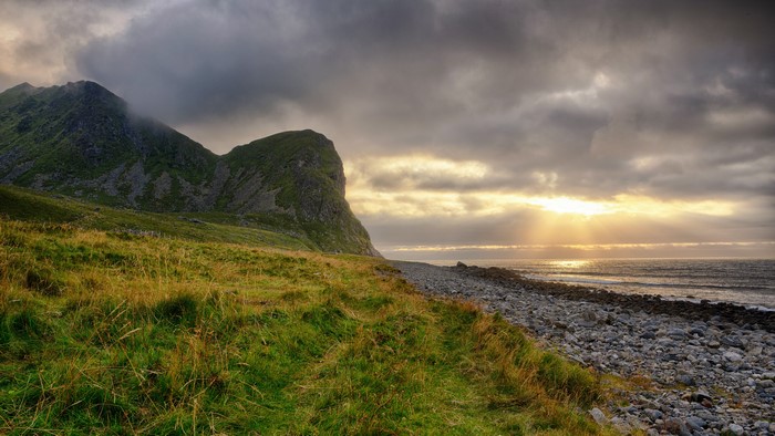 Unstad Beach, Lofoten, Norway Coastline with Mountains and Sunset